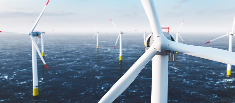 Offshore wind power and energy farm with many wind turbines on the ocean